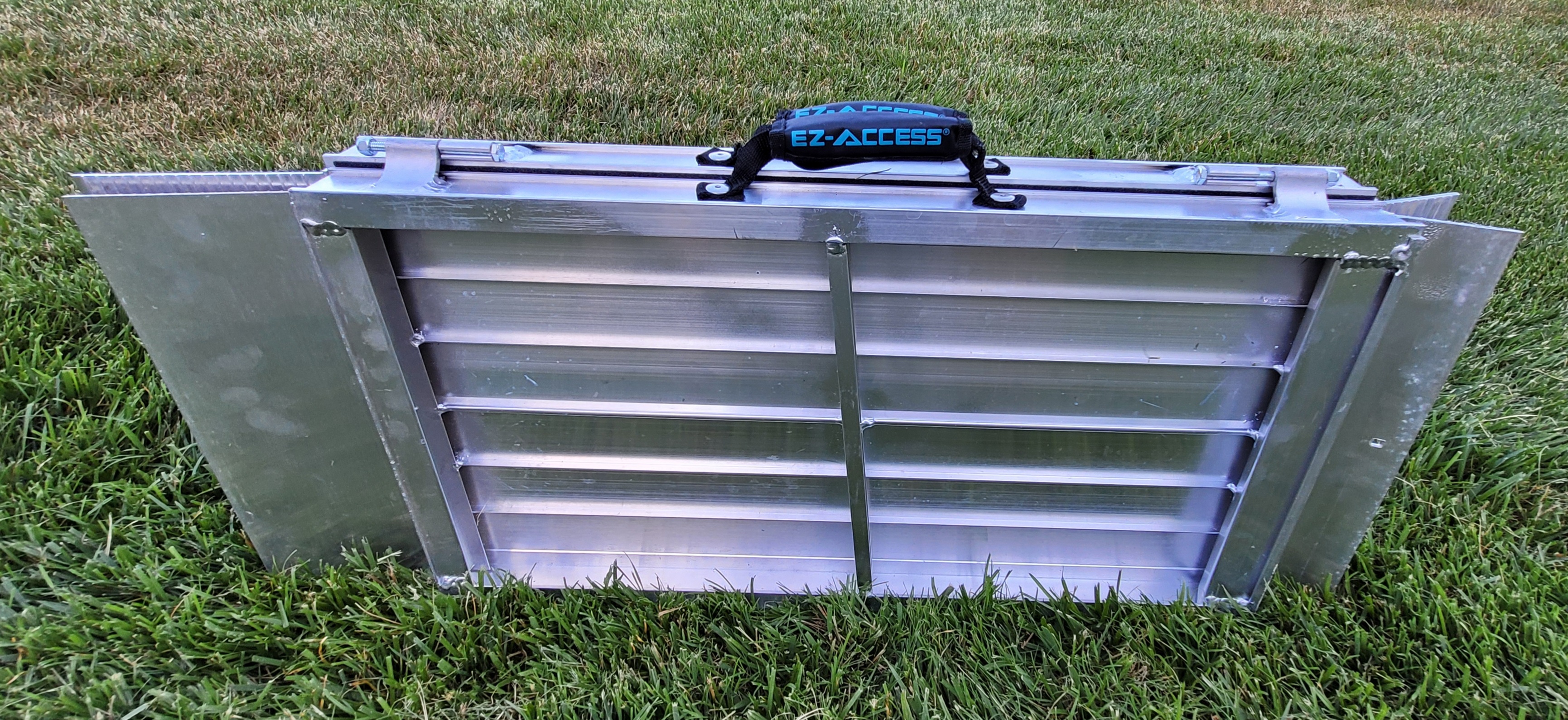 A folded suitcase ramp.