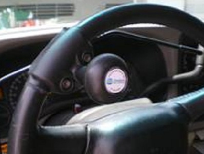 Spinner ball steering AT device. Pic edited from RehabMart website.